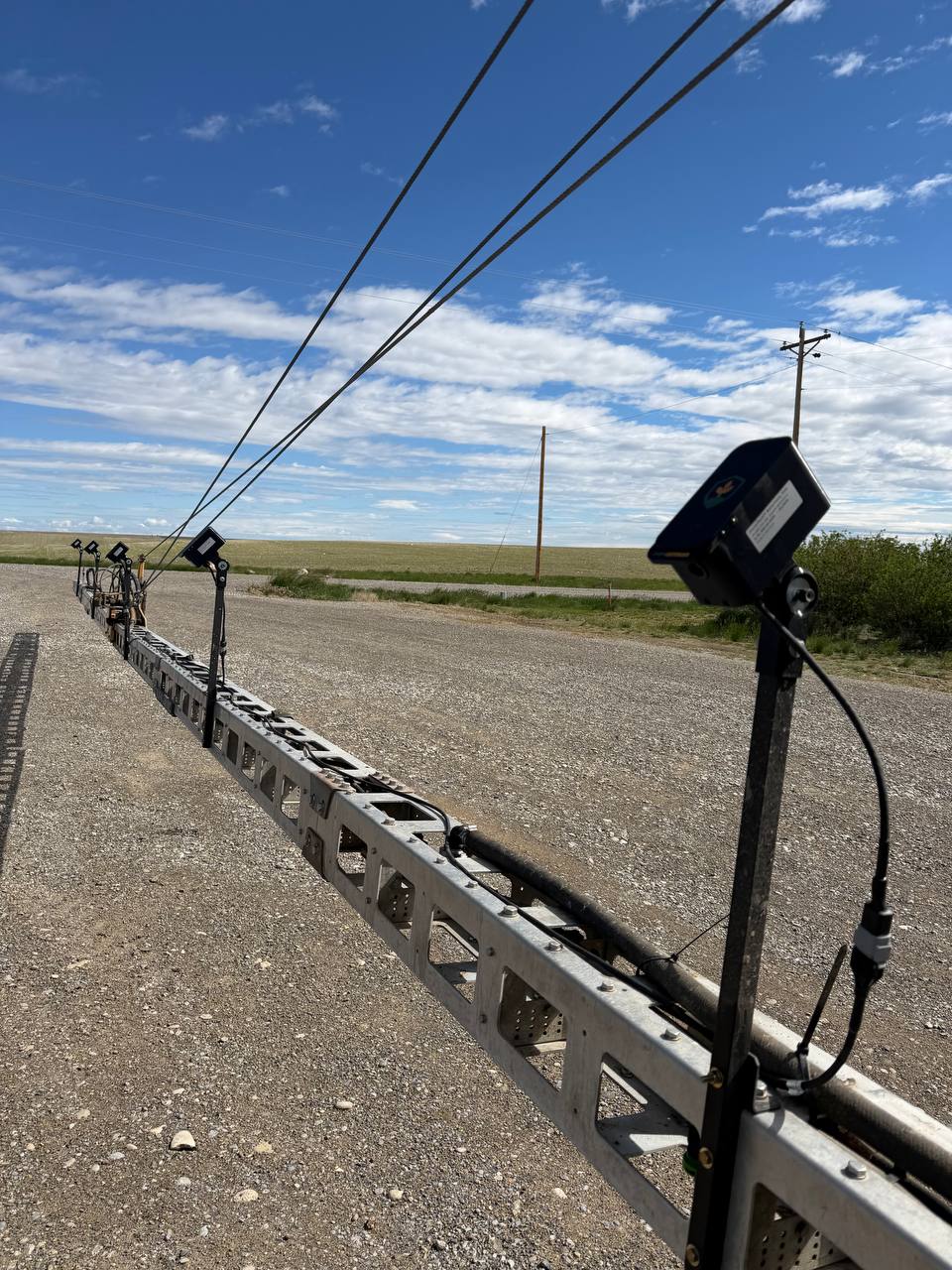 FarmDefender cameras mounted along a sprayer boom in Montana
