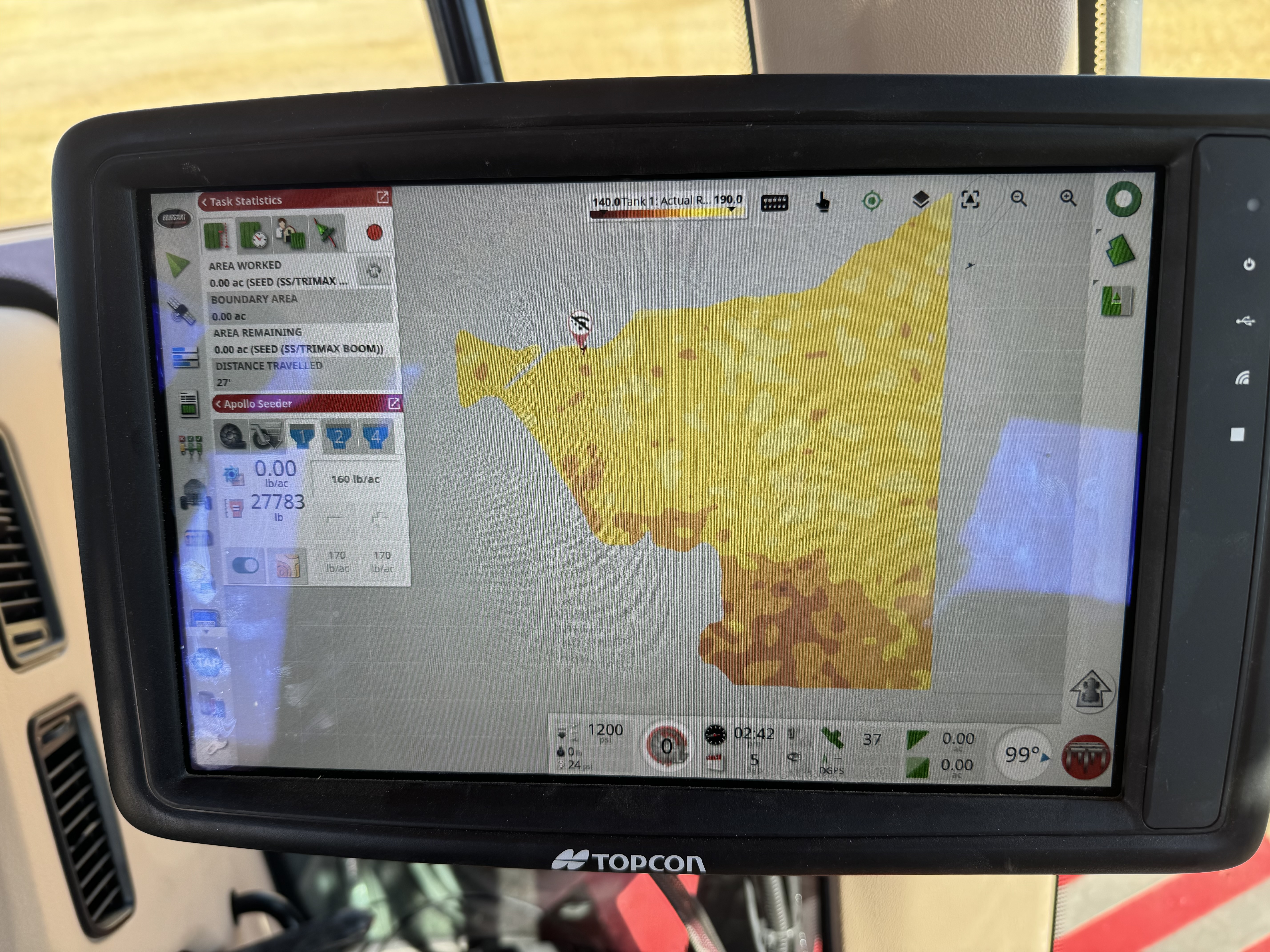 Topcon console in the cab showing a variable-rate phosphorus prescription map loaded and ready to apply